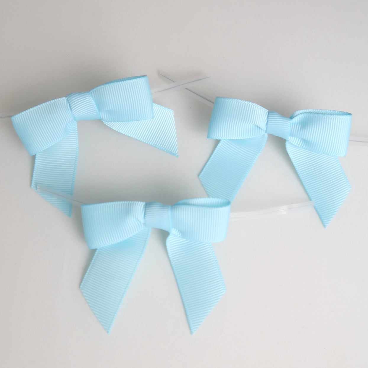 Verschluss mit Schleife - hellblau - 50 Stk