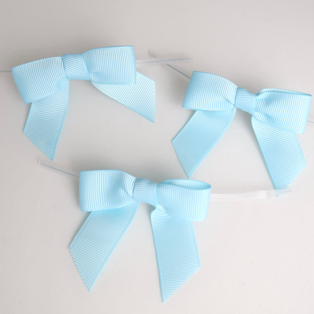 Verschluss mit Schleife - hellblau - 50 Stk