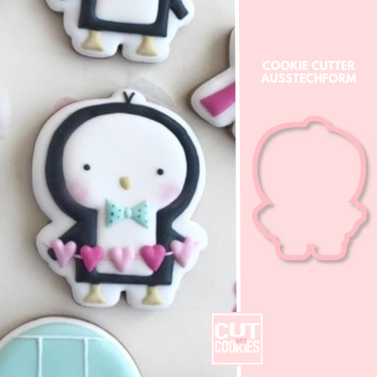 Cookie cutter penguin with heart garland